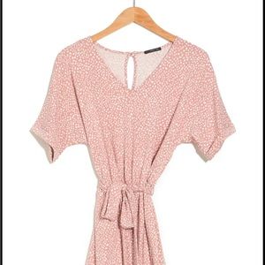 Coral stretchy romper. Cute romper but was final sale and it’s too big.